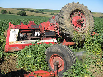 Photo of an accident scene involving a tractor overturn